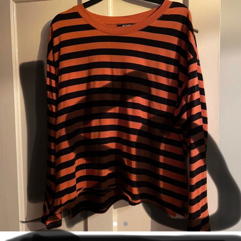 ISO/ In Search Of  Do not Buy ! MonkI Orange and black striped long sleeve.
